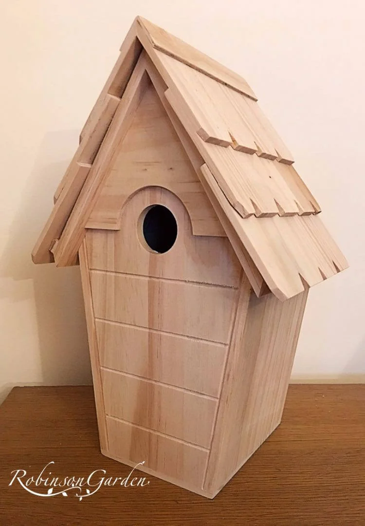 Bespoke wooden birdbox / birdhouse design hand painted in Lincolnshire, England, UK using Farrow & Ball exterior eggshell paint or external Varnish. Uniquely crafted using sustainable FSC certified timber / wood. Available in a range of colours including varnish and unpainted to allow you to paint your own birdhouse. This will prevent the how to make your own birdhouse or how to make your own birdbox question. Birdbox camera not included, birdhouse camera not included. The birdbox design is different to Argos, B&M, ALDI, homebase, dobbies, gardman, home bargains, pets at home, B&Q, b & q, amazon, M&S, Robert dyas, rspb, ikea, john lewis, rhs, gumtree, asda, argos, wilkinsons, kingfisher, the garden obelisk company, QVC or any other garden centre. We are an online only store and we are not on the high street. We also have outlet shops across etsy and ebay UK. Not made from metal or copper. Our design plan, dimensions and height are suitable for small birds including blue tits, grey tits, Goldfinch, house sparrow, Chaffinch, Long-tailed tit, siskin and Robin. Amendments on request can be made for titcotes. Bespoke wooden birdhouses and birdboxes are assembly free and no set up required. Visit our gallery to see all the bespoke wooden birdhouse images. Dovecotes are hand delivered ready assembled. Perfect birdhouses for your garden. Designs include Lyndhurst wooden birdhouse, Stamford wooden birdbox and Burley birdbox. With wooden roof.